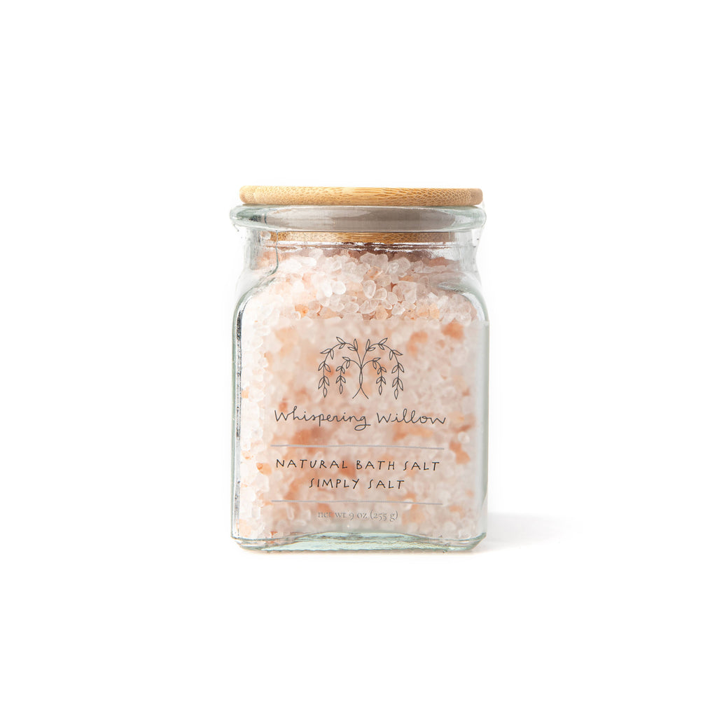 Clear glass jar of white and pink salt.