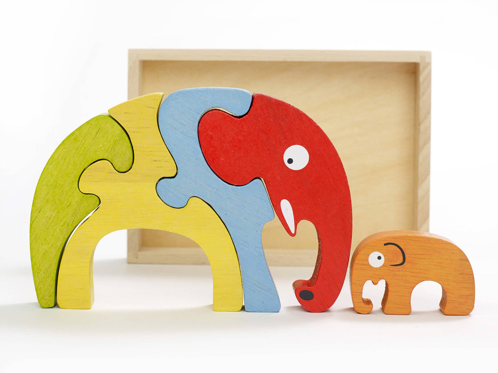 Image shows a colorful tray puzzle of a family of elephants in various colors.