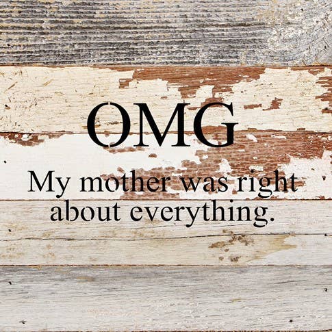 Image shows a natural wood sign. Text reads "OMG my mother was right about everything."