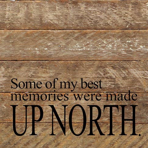 Image shows a natural wood sign. Text reads "Some of my best memories were made up north."