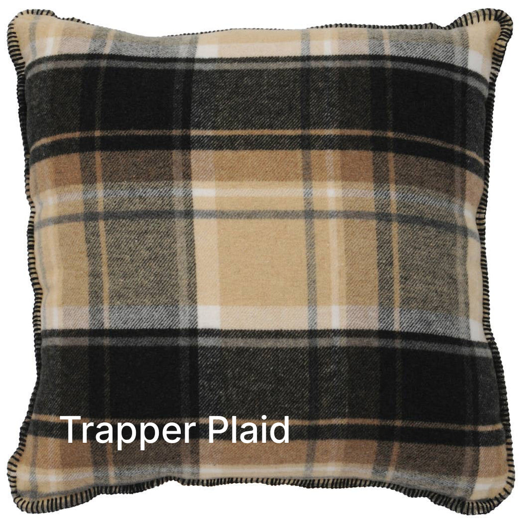 Image shows beige and black plaid pillow on a white background.