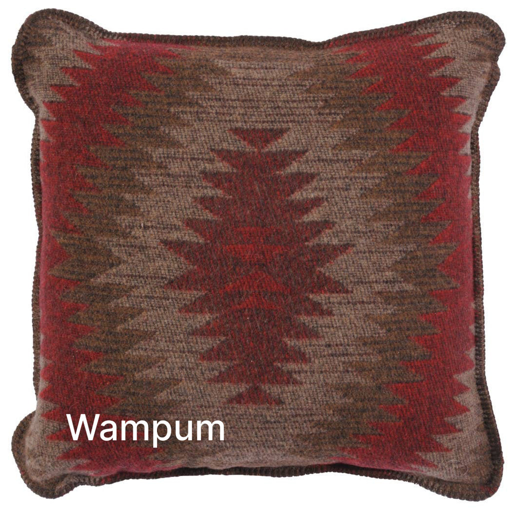 Image shows a red, brown, and gray pillow with a starburst geometric pattern.